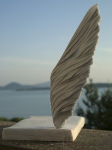 Messaggi d´Amore, Love messages, one of the sculptures of the "Garden of Poetry". In the background you see Trasimeno Lake